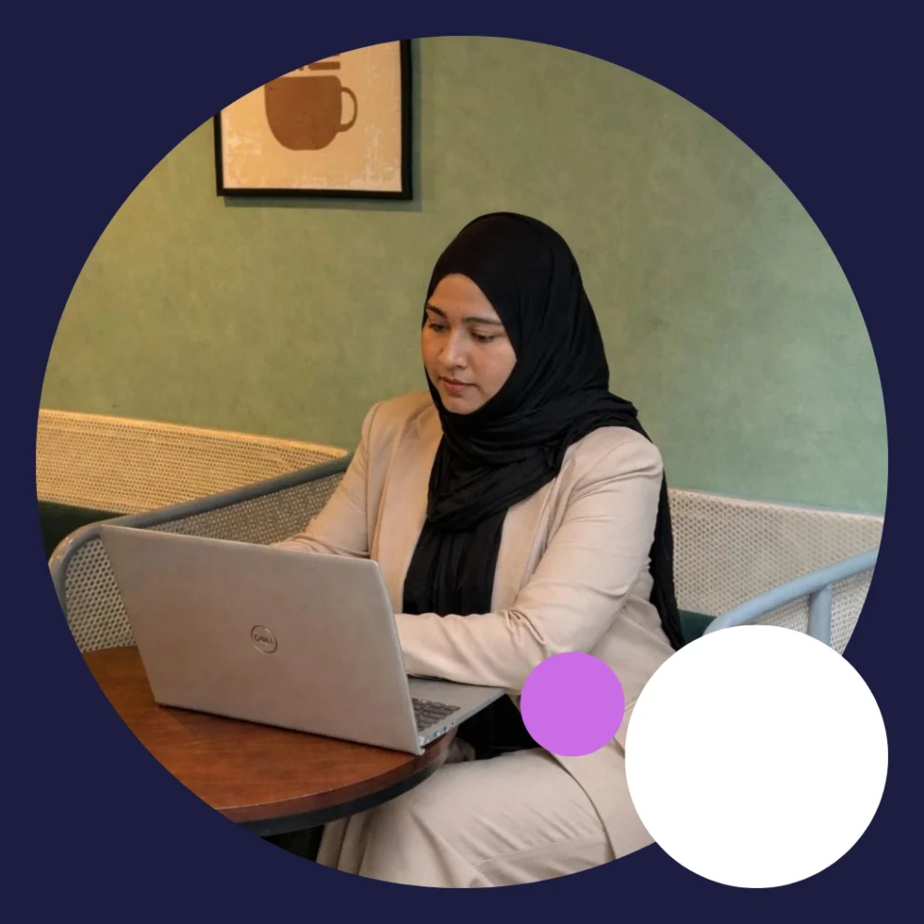 “A digital marketing student working on a laptop in a calm and creative workspace.